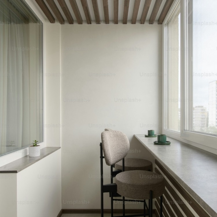 bar with two stools facing a window